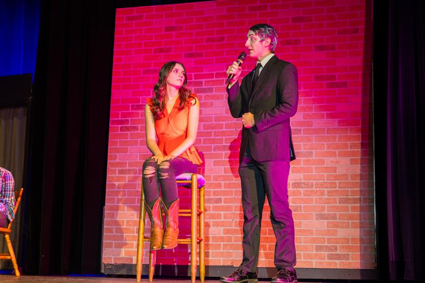 Students perform onstage